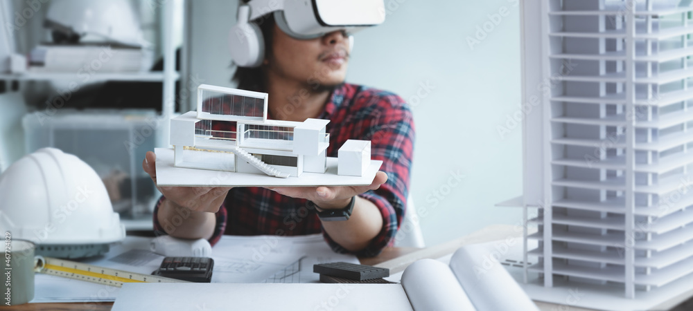 Fototapete engineer or architects wearing virtual reality headsets for work with virtual reality modeling softw