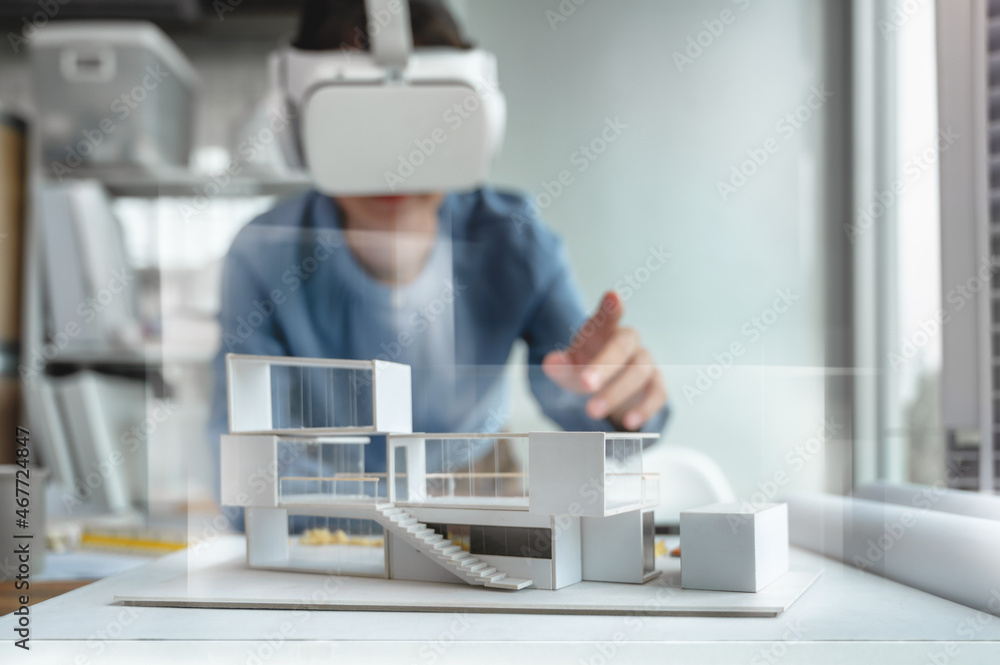 Fototapete architects female wearing virtual reality headsets for work with virtual reality modeling software a