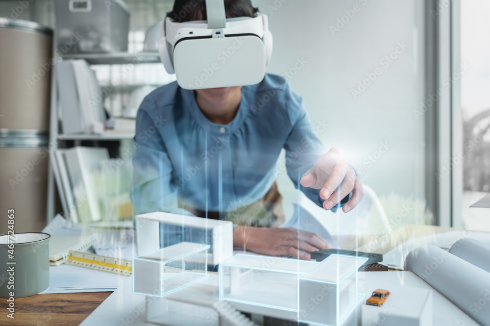 Fototapete architects female wearing virtual reality headsets for work with virtual reality modeling software a