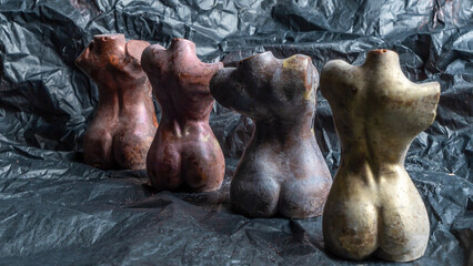 Chocolate figurines in the form of a naked female body. LGBT concept. Unusual sweets. Image for LGBTQ design.