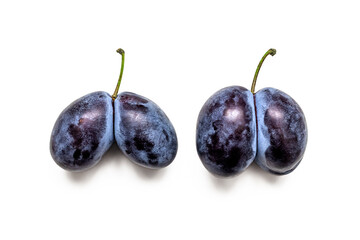 Two pairs of conjoined plums isolated on a white background