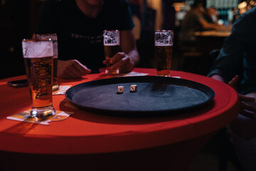Dice game in cafe with beer