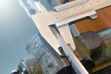 Katana sword making. Measuring control of kissaki blade thickness.