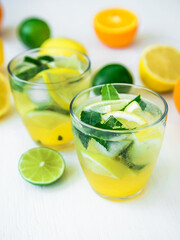 Fresh diet drink with cucumber, lime, lemon and orange