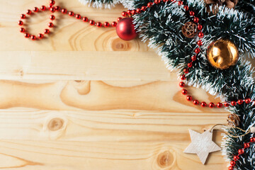 christmas background with tinsel and toys on a wooden background