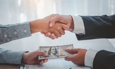 businessman was negotiating a bribery arrangement in which the dollar would be accepted as a bribe. Concepts of anti-bribery and anti-corruption.