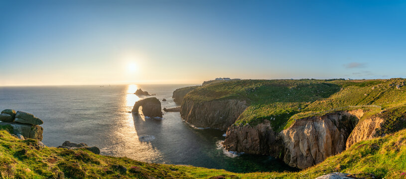Land's End sunset panorama with Enys Dodman arch, Cornwall
