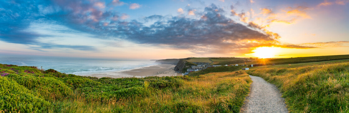 Watergate Beach panorama at sunrise in Cornwall. UK