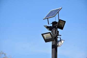 Photovoltaic panel which installed on the top of the metal pole to store and use the sun power around the public park at night.