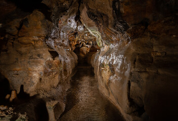 exploring underground caves with stalactite and stalagmite growth