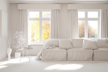 Fototapeta premium Stylish room in white color with sofa and autumn landscape in window. Scandinavian interior design. 3D illustration