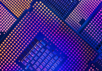 Macro close-up shot of a microchip, processor (CPU) concept of a high-tech control system for artificial intelligence on a board (PCB), central processing unit of a computer with components inside