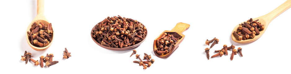 Set of spice clove (Syzygium aromaticum) in wooden spoon and scoop, clay plate, scattering on white background isolated. Close up, macro