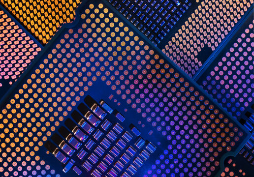 Macro close-up shot of a microchip, processor (CPU) concept of a high-tech control system for artificial intelligence on a board (PCB), central processing unit of a computer with components inside