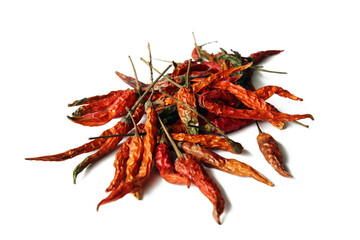 Dried red chillies put together on a white background. Isolated.