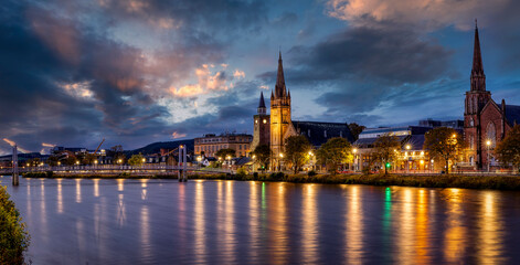 Fototapeta na wymiar Panormic view of the cityscape of Inverness, Scotland, during evening time with Greig Street Bridge, River Ness and the old town