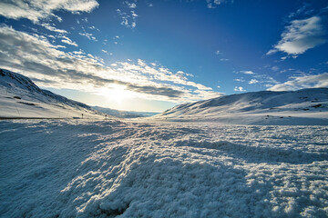 iced lake at a rest area in norway with glacier ice