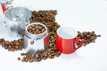 filter coffee maker and coffee grains on white table