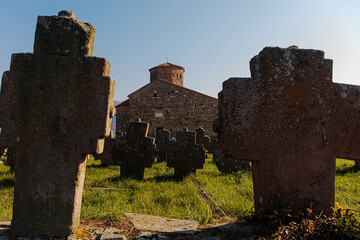 Fototapeta na wymiar Serbian Orthodox Church of the Holy Apostles Peter and Paul, Ras and gravestones