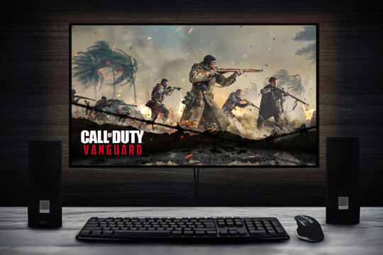 Cali, Colombia - November 7, 2021: Call of Duty: Vanguard video game logo on PC screen with keyboard, mouse and speakers