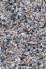 Beach sand of small, tiny pebbles and seashells