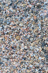 Beach sand of small, tiny pebbles and seashells