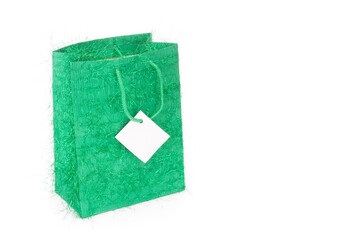 Green gift bag isolated on white background