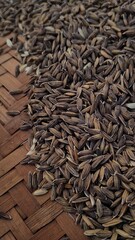 cumin seeds on wooden background