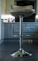 View of modern grey kitchen bar stool