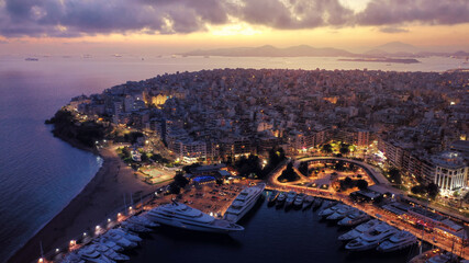 Obraz premium Aerial drone photo of iconic round port and Marina of Zea or Passalimani at dusk with beautiful colours, Piraeus, Attica, Greece
