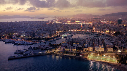 Fototapeta na wymiar Aerial drone photo of iconic round port and Marina of Zea or Passalimani at dusk with beautiful colours, Piraeus, Attica, Greece