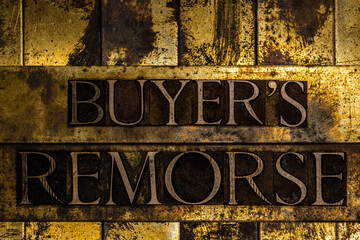 Buyer's Remorse text message on textured grunge copper and vintage gold background