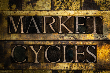 Market Cycles text message on textured grunge copper and vintage gold background
