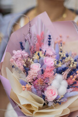 Bouquet dried flower arrangement in pink, yellow and purple. Striking flowers arrangement, comes beautifully wrapped for gift-giving.