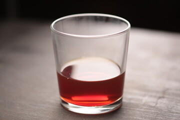 whiskey in a glass on a dark table