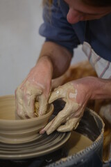 the man behind the potter's wheel