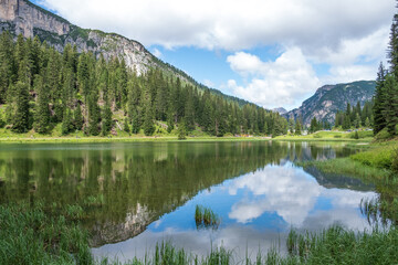 Fototapeta na wymiar Misurina Lake in calm water. Stunning view on the majestic Dolomites Alp Mountains, Italy, National Park Tre Cime di Lavaredo.