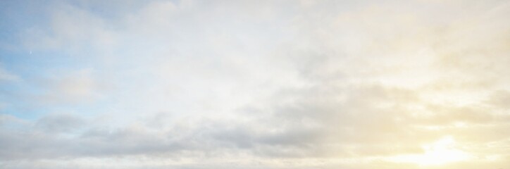 Ornamental clouds. Dramatic sky. Epic storm cloudscape. Soft sunlight. Panoramic image, texture,...