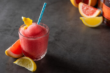 Luxury cocktail and cocktail shaker on black stone background