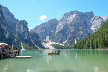 Lake Braies (also known as Pragser Wildsee or Lago di Braies) in Dolomites Mountains, Sudtirol, Italy. Romantic place with typical wooden boats on the alpine lake. Hiking travel and adventure.