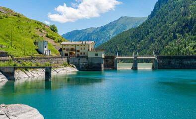 Fototapeta na wymiar The beautiful Pontechianale Lake on a summer morning. Province of Cuneo, Piedmont, Italy.