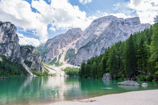 Lake Braies (also known as Pragser Wildsee or Lago di Braies) in Dolomites Mountains, Sudtirol, Italy. Romantic place with typical wooden boats on the alpine lake. Hiking travel and adventure.