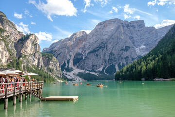 Lake Braies (also known as Pragser Wildsee or Lago di Braies) in Dolomites Mountains, Sudtirol, Italy. Romantic place with typical wooden boats on the alpine lake. Hiking travel and adventure.