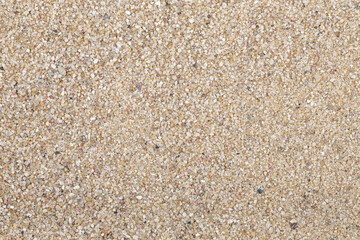 Sandkörner oder Sand als Nahaufnahme als Hintergrund von oben