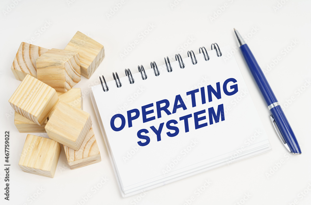 Poster On the table are cubes, a pen and a notebook with the inscription - Operating System