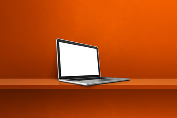Laptop computer on orange shelf background