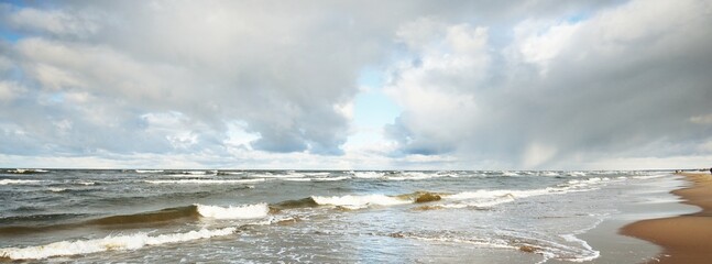 Storm clouds above the Baltic sea, cyclone in winter. Dramatic sky, waves and water splashes....