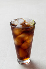 Alcoholic cocktail of rum with ice and lime, close-up, macro photography.