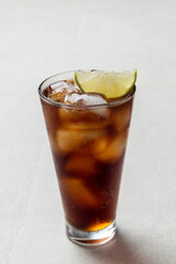 Alcoholic cocktail of rum with ice and lime, close-up, macro photography.