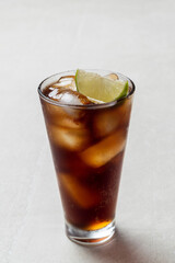 Alcoholic cocktail of rum with ice and lime, close-up, macro photography.